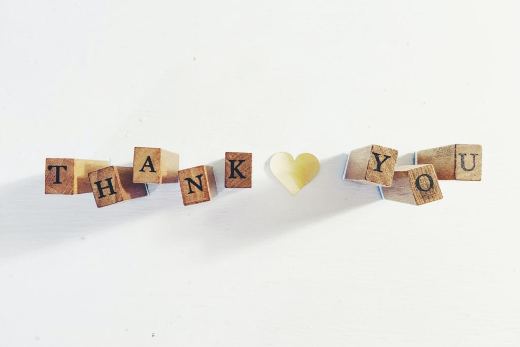 an image the says thank you with wooden blocks